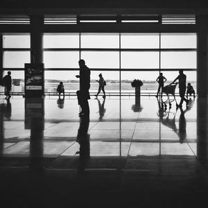 Silhouette people waiting at airport