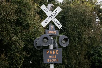 Information sign against trees