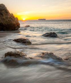 Scenic view of sea against sky during sunset