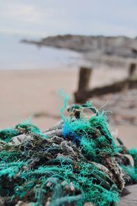 Close-up of fishing net on beach