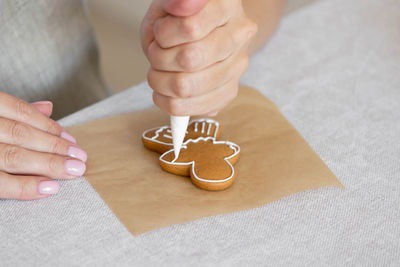 Cropped hand of person preparing food