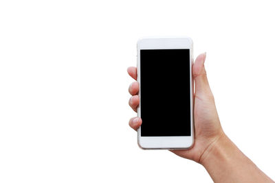 Midsection of person holding mobile phone over white background