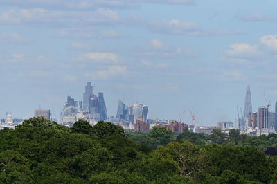 Buildings in city against sky