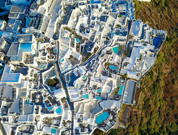 High angle view of city by buildings