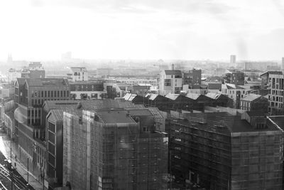 High angle view of buildings in city against sky