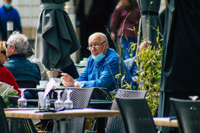 People sitting on chair at table