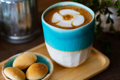 Close-up of coffee cup on table