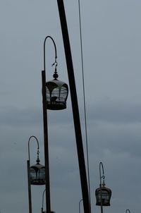 Low angle view of street light against sky