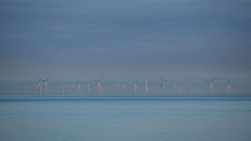 Offshore platform windmills of rampion windfarm off the coast of brighton, sussex, uk.