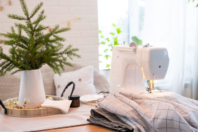 Close-up of sewing machine on table