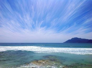 Scenic view of sea against blue sky