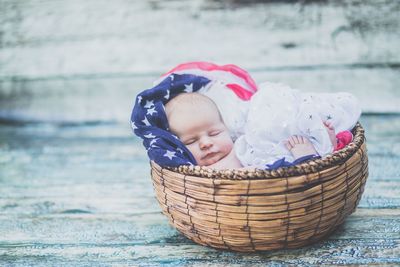 Close-up of cute boy in basket