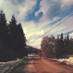 View of road against cloudy sky