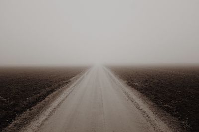 Road in desert against clear sky