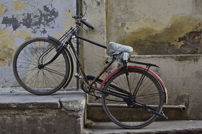 Bicycle leaning against wall