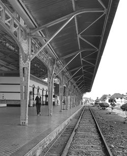 People waiting at railroad station platform