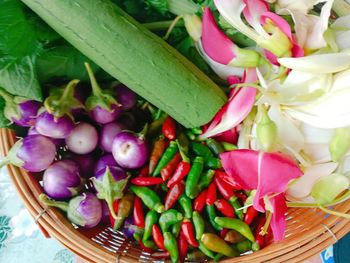 High angle view of purple chili peppers in basket
