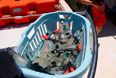 High angle view of diving equipment in basket