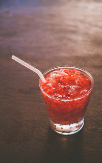 Close-up of red drink on table