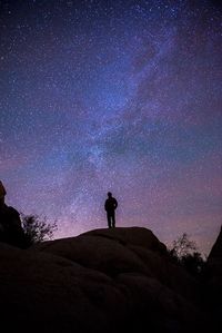 Silhouette of people standing on landscape