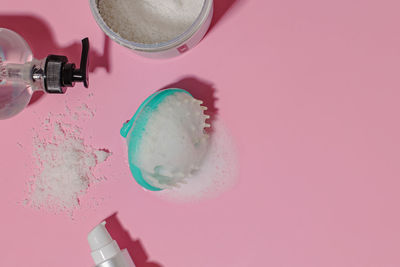 High angle view of dental equipment on pink background