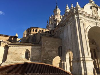 Low angle view of built structures against blue sky