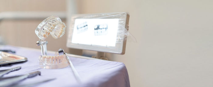 Close-up of glasses on table at home