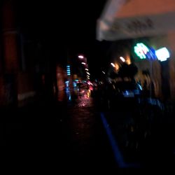 Close-up of illuminated road in city at night