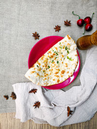 Fruit salad on table against white background