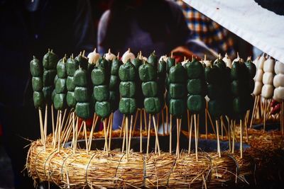 Close-up of vegetables on stick for sale at market