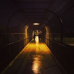 Man in illuminated tunnel