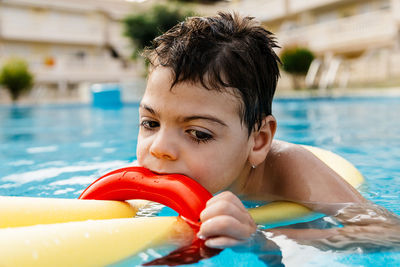 Boy swimming in pool