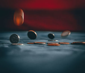Close-up of coins on table