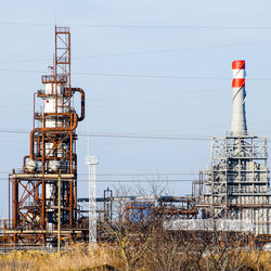 Low angle view of electricity pylon against sky