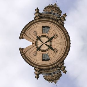 Low angle view of clock tower against sky