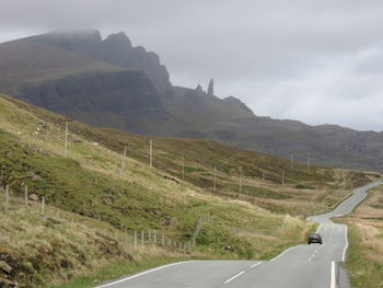 Country road leading towards mountains