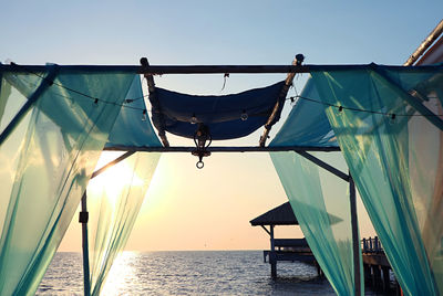 Romantic tent on the beach against gorgeous sunset