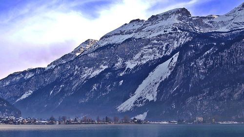 Scenic view of lake against cloudy sky