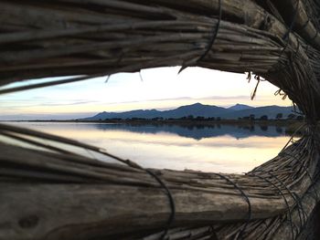 Close-up of wood against sky at sunset