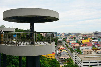 High angle view of street and buildings against sky