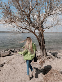 Full length of woman on shore at beach