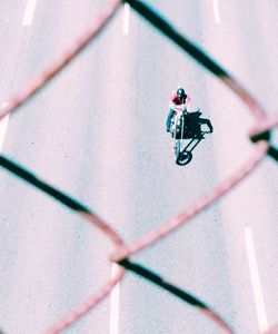 High angle view of person riding bicycle on street