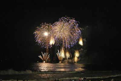 Firework display at night