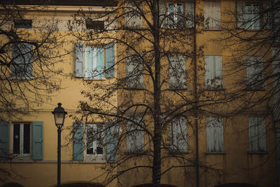 Low angle view of street light against building