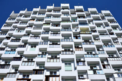 Low angle view of building against clear blue sky