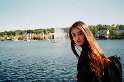Portrait of beautiful woman against sky