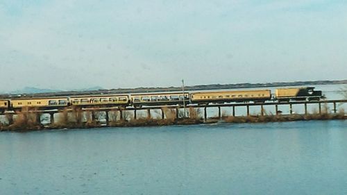 Bridge over water against clear sky