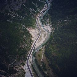 Aerial view of winding road amidst mountains