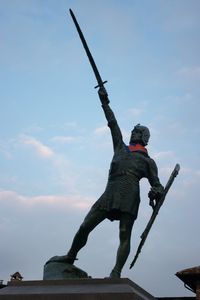 Low angle view of woman against sky