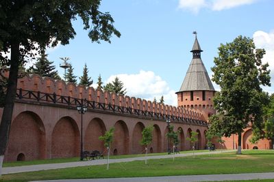 Wall of an ancient fortress with a tower.